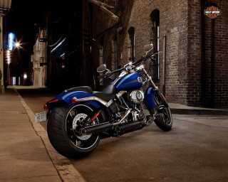 Blue motorcycle parked road building - a blue motorcycle free wallpaper
