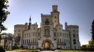 Castle clocktower walkway entrance garden - a large castle free wallpaper
