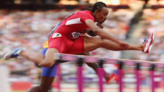 Man running hurdle stadium crowd - derek chittock free wallpaper