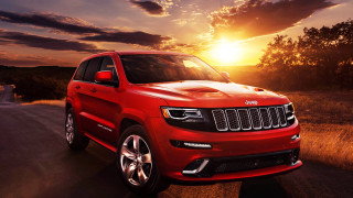 Red jeep sunset road driving - the sun behind free wallpaper