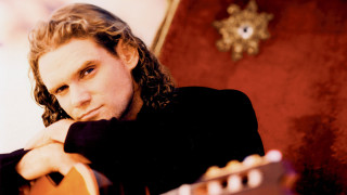 Man long hair chair guitar - alain tasso free wallpaper
