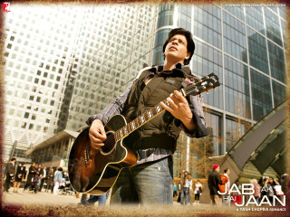 Man holding guitar building people - a guitar in front free wallpaper