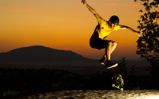 Man flying skateboard sunset park - cinematic photography free wallpaper