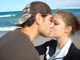 Man woman kissing beach ocean 2 - derek zabrocki free wallpaper