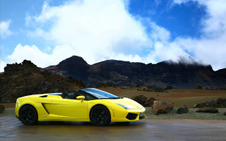 Yellow sports car mountain range - a yellow sports car free wallpaper