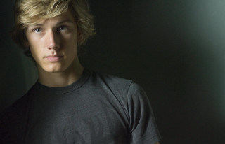 Blonde man serious look black - a young man free wallpaper