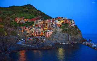Small village cliff water night - the water below free wallpaper