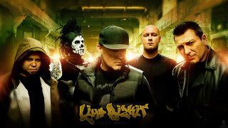 Men group hallway skull wall - the wall behind them free wallpaper