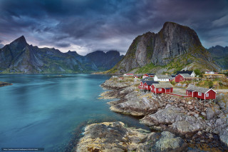 Scenic village rocky shore mountains - the background and a body of water free wallpaper