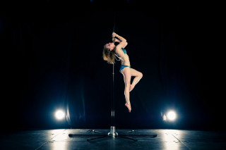 Woman bikini pole suspended dark - a woman in a bikini free wallpaper