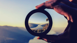 Person holding mirror mountain background 2 - a person holding free wallpaper