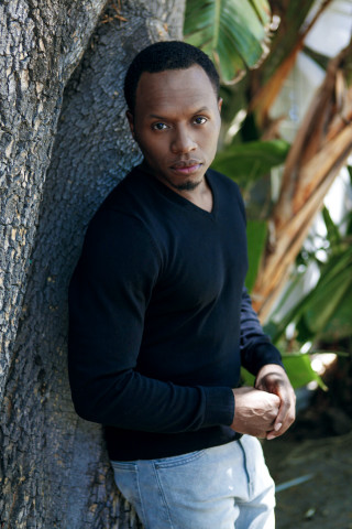 Man leaning against tree black - a black shirt and jeans free wallpaper