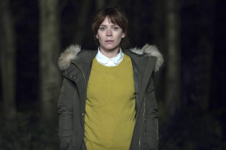 Woman green jacket woods night - a hood free wallpaper