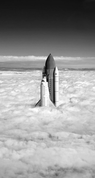 Space shuttle flying above clouds - free airplane wallpaper
