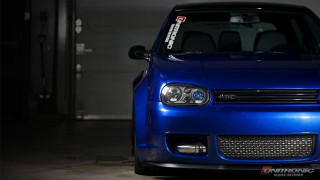 Blue car parked garage license - a garage free wallpaper