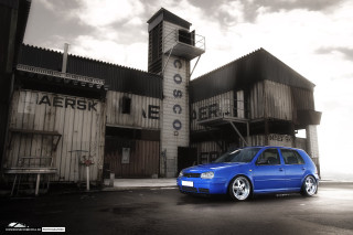 Blue car parked building clock - a clock tower free wallpaper