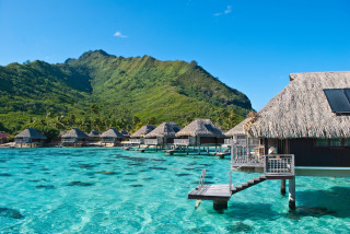 Dock beach huts mountains blue - the water near a beach free wallpaper