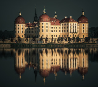 Large building red roof clock - a body of water free wallpaper