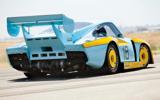 Blue yellow racecar road grass - a road next free wallpaper