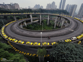 Circular road yellow taxis city - tall free wallpaper