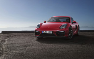 Red porsche sports car ocean - feature free wallpaper for desktop