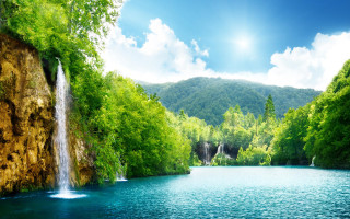 Waterfall lake trees mountains blue - the middle of a lake free wallpaper