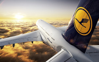 Jetliner cloudy sky sunset yellow 5 - a cloudy sky above the clouds free wallpaper