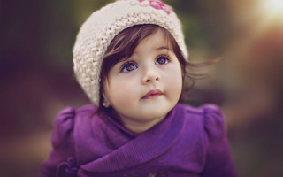 Little girl knitted hat looking 2 - a little girl free wallpaper