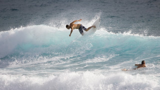 Surfing man wave ocean swimming - top of a surfboard in the ocean free wallpaper