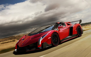 Red sports car cloudy road - a cloudy day free wallpaper
