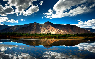 Mountain range lake clouds sky 5 - a lake in the foreground free wallpaper