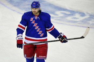 Man blue jersey hockey stick - a hockey stick free wallpaper