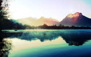 Lake mountains sunset reflection boat - a sun free wallpaper