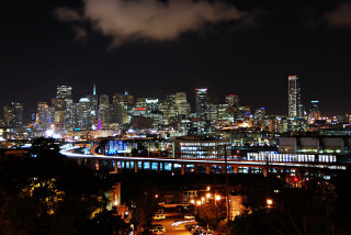 City skyline night train bridge - a train free wallpaper