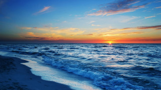Sunset ocean waves boat distance - a boat in the distance free wallpaper