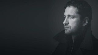 Man black coat serious look - his face and shoulders free wallpaper