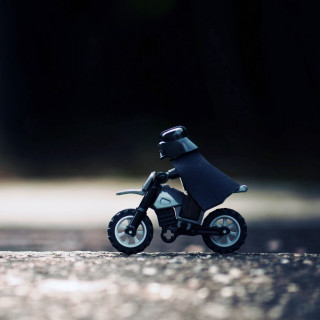 Toy motorcycle helmet black seat - a tilt shift photo free wallpaper