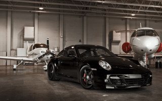 Black sports car garage small - the ground in front free wallpaper