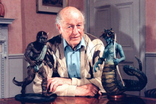 Man sitting table animal statues - peter konig free wallpaper
