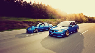 Two cars driving road forest - a road next free wallpaper
