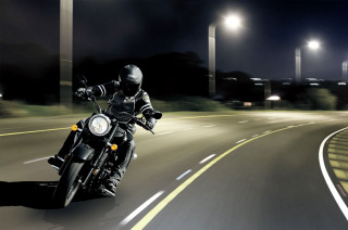 Man motorcycle curvy road nighttime - the side of the road free wallpaper
