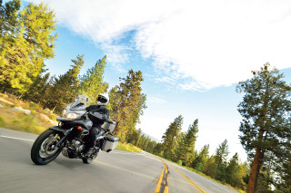Motorcycle road trees hill sky - digital free wallpaper