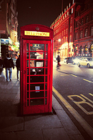 Red telephone booth city street - a city street free wallpaper