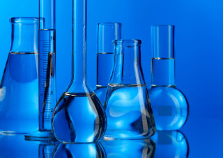 Blue bottles microscopic particulate neoplasticism - a blue background behind them free wallpaper