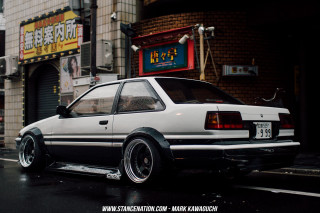 White car parked street building - clean free wallpaper
