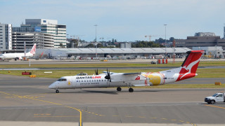 Plane runway day buildings truck - side profile free wallpaper