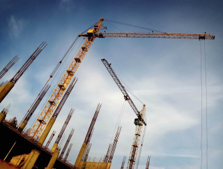 Crane construction site blue sky - a crane free wallpaper