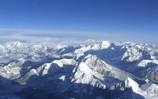 Mountain range airplane window blue 8 - a view of a mountain range free wallpaper