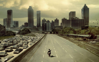 Skateboarder riding street parking lot - a skateboard free wallpaper