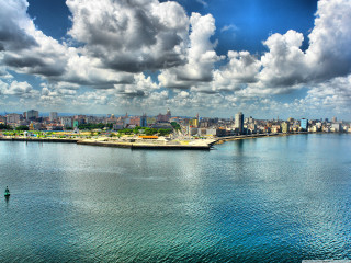 Water city clouds person green - felipe seade free wallpaper